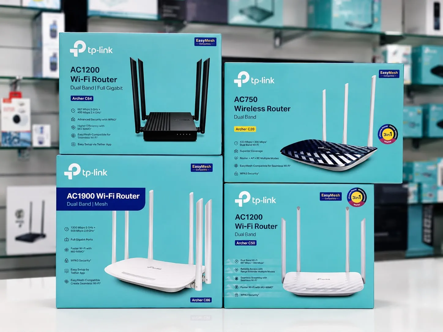 Boxed TP-Link Wi-Fi routers in Oman on display at Sky Gadgets, including Archer C64, Archer C20, Archer C86, and Archer C50